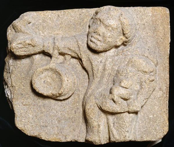 Carved stone depicting a monk carrying items, Muchelney Abbey, Somerset, c2010
