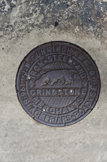 Coal hole plate made by JW Cunningham & Co, Lower Marsh, Lambeth, London, 2010