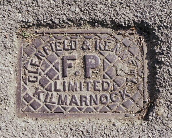 Iron water stop tap cover plate made by Clenfield & Kennedy of Kilmarnock, Swindon, Wiltshire, 2006