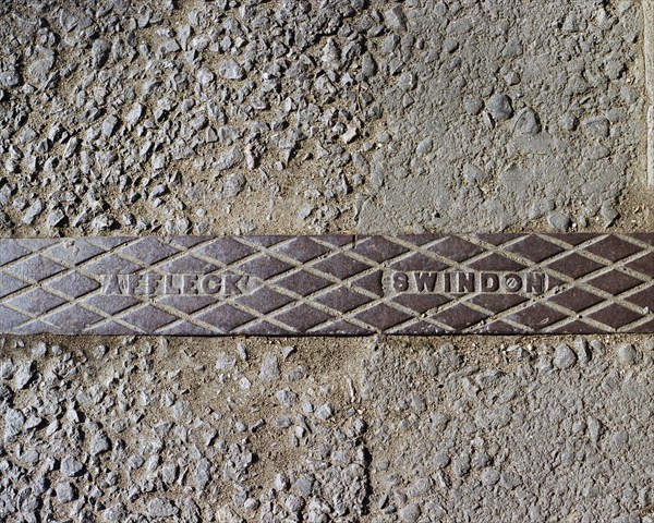 Pavement rainwater gully cover plate made by Affleck of Swindon, Swindon, Wiltshire, 2006