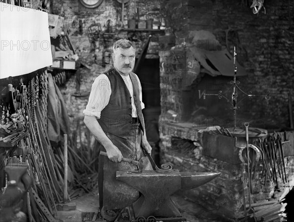 Mr Jefferies at work in the forge, Southrop, Cotswolds, Gloucestershire, 1938