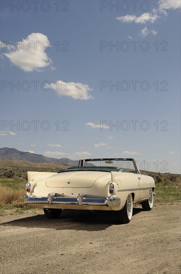 Dual Ghia 1957. Artist: Simon Clay.