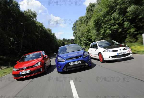 VW Golf GTi Renault Megane Sport R26R and Ford Focus RS 2009. Artist: Simon Clay.