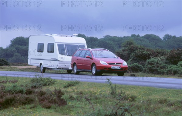 2002 Citroen C5 hdi towing a caravan. Artist: Unknown.