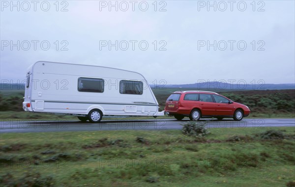 2002 Citroen C5 hdi towing a caravan. Artist: Unknown.