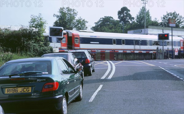 Traffic queue at level crossing in Brockenhurst, Hampshire. Artist: Unknown.