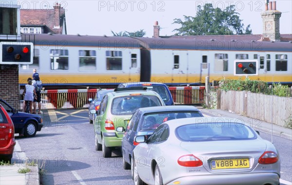 Traffic queue at level crossing in Brockenhurst, Hampshire. Artist: Unknown.
