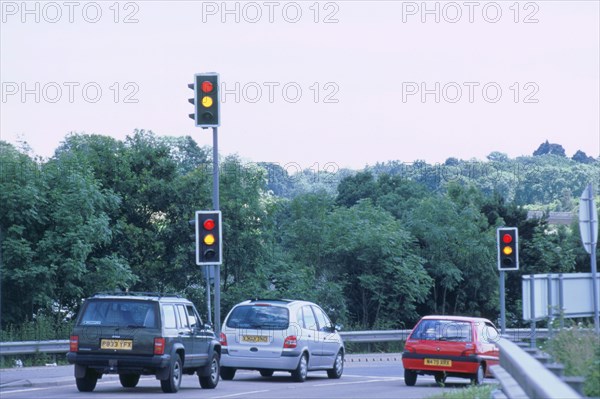 Traffic stopped at Traffic lights. Artist: Unknown.