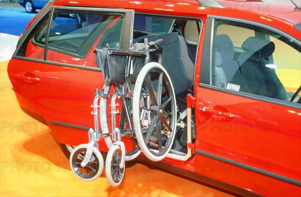 Wheelchair access into car. Artist: Unknown.