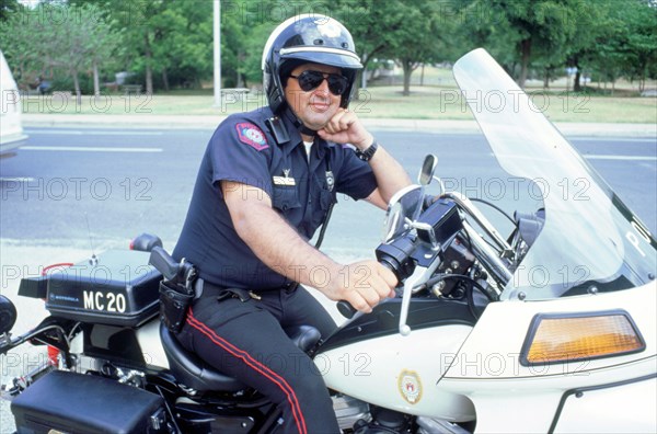 Policeman on 1994 Harley Davidson, Austin Texas. Artist: Unknown.