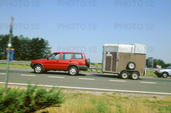 1997Ford Maverick towing horse box. Artist: Unknown.