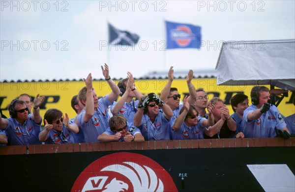 Nissan team celebrate victory 1998 British touring cars.. Artist: Unknown.