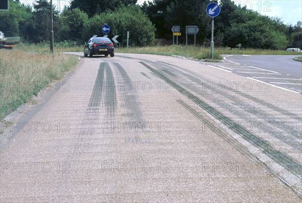 Tyre skidmarks on road surface. Artist: Unknown.