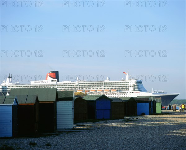 Queen Mary II sails past Beach Huts, Calshot May 2004. Artist: Unknown.