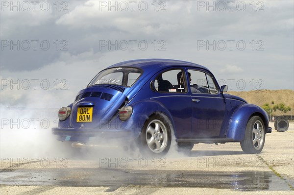 VW Beetle Burning out. Artist: Unknown.