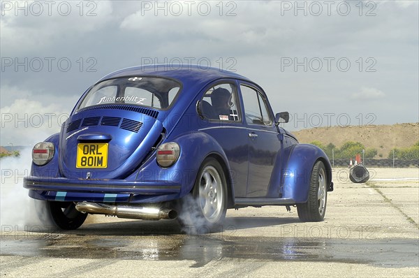 VW Beetle Burning out. Artist: Unknown.