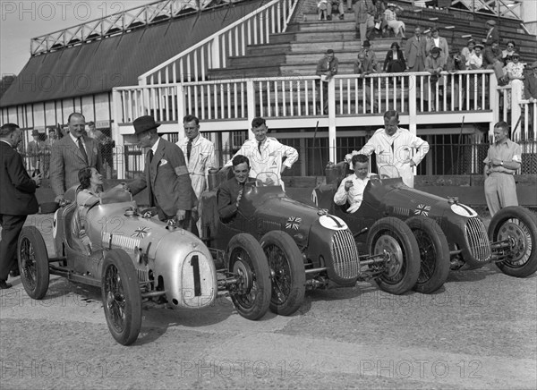 Austin 7 works team, Brooklands 1937. Artist: Bill Brunell.