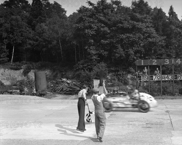 Kay Petre's Austin OHC 744 cc, LCC Relay GP, Brooklands, 26 July 1937. Artist: Bill Brunell.