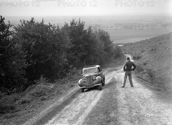 1935 Hillman Minx 1185 cc competing in a Talbot CC trial. Artist: Bill Brunell.