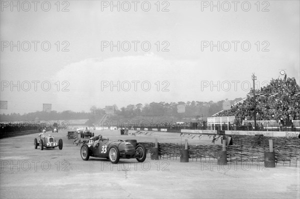 Riley 1985 cc leading MG K3 Magnette, JCC International Trophy, Brooklands, 2 May 1936. Artist: Bill Brunell.