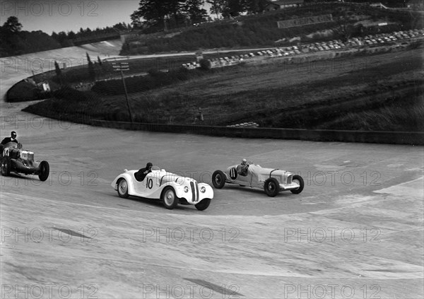 MG K3, Frazer-Nash BMW and Alvis cars racing at Brooklands. Artist: Bill Brunell.