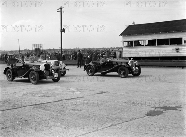 Triumph and Alvis cars at the MCC Members Meeting, Brooklands, 10 September 1938. Artist: Bill Brunell.