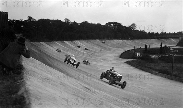 Bentley leading a Barnato-Hassan Special and a Jensen, October Long Handicap, Brooklands, 1938. Artist: Bill Brunell.