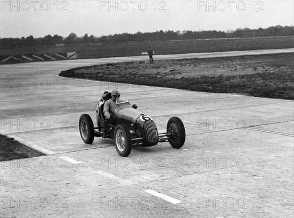 Austin 7 twin cam racing single seater on the Campbell Circuit, Brooklands. Artist: Bill Brunell.