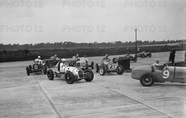 Cars racing at the BARC Meeting on the Campbell Circuit, Brooklands, 15 October 1938. Artist: Bill Brunell.