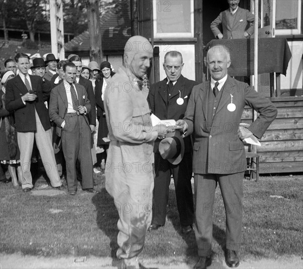 Earl Howe at the BARC Meeting, Brooklands, 25 May 1931. Artist: Bill Brunell.