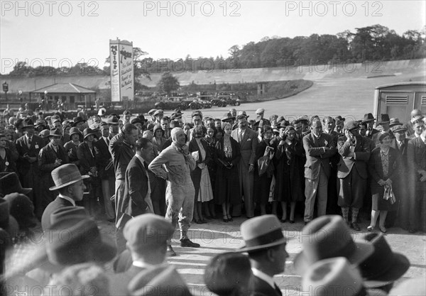 Earl Howe at the BARC Meeting, Brooklands, 25 May 1931. Artist: Bill Brunell.