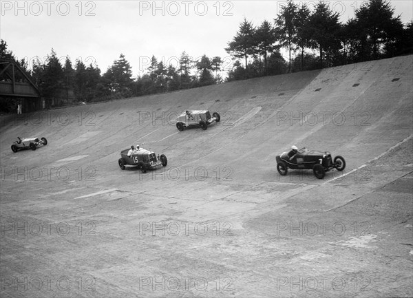 Talbot, Lagonda and Invicta racing on the Members Banking at Brooklands. Artist: Bill Brunell.