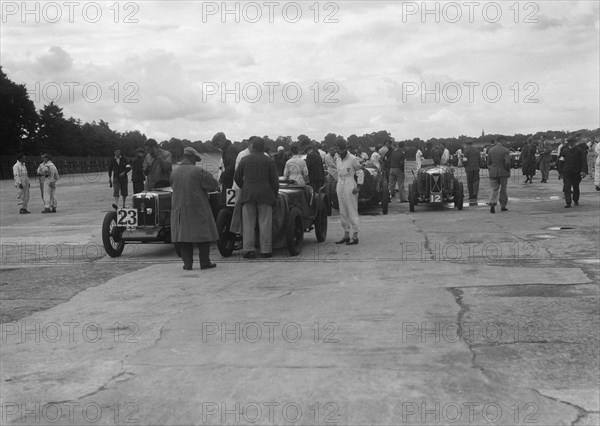 MG and Austin 7 at the LCC Relay GP, Brooklands, 25 July 1931. Artist: Bill Brunell.