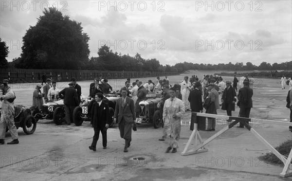 Riley 9, Aston Martin and Salmson at the LCC Relay GP, Brooklands, 25 July 1931. Artist: Bill Brunell.