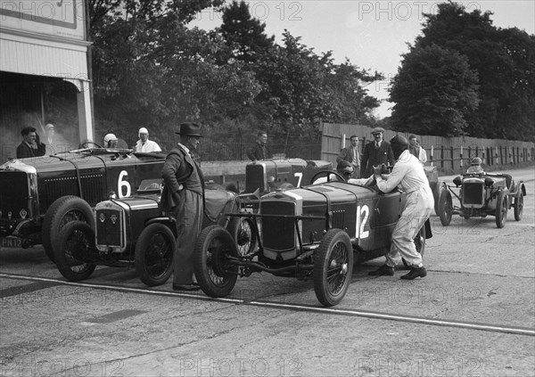 Minerva, Austin and Alvis at the start of an Inter-Club Meeting, Brooklands, 20 June 1931. Artist: Bill Brunell.