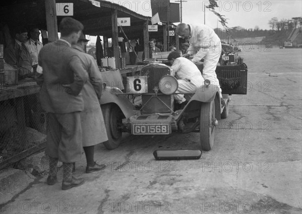 Talbot 90 of E and SJ Burt in the pits at the JCC Double Twelve race, Brooklands,  May 1931. Artist: Bill Brunell.