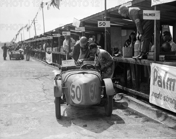 Vernon Balls and AB Gilbert's Austin Ulster at the JCC Double Twelve race, Brooklands, 8/9 May 1931. Artist: Bill Brunell.