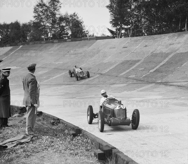 Reg Parnell's MG K3 leading B Bira's Maserati, JCC International Trophy, Brooklands, 2 August 1937.  Artist: Bill Brunell.