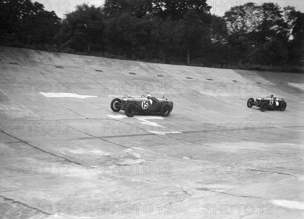 Two Riley 9 Brooklands racing on the banking at a JCC Members Day, Brooklands. Artist: Bill Brunell.