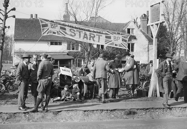 Start line for the Surbiton Motor Club Grand Cup, the Talbot Hotel, Ripley, Surrey, 1929. Artist: Bill Brunell.