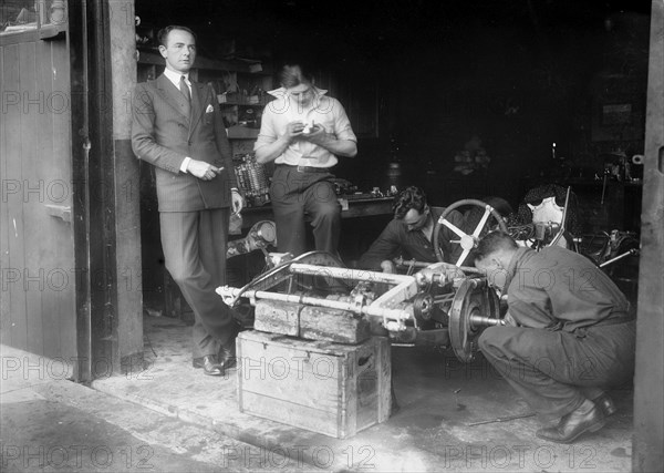 Working on the chassis of Raymond Mays' 2996 cc Vauxhall-Villiers. Artist: Bill Brunell.