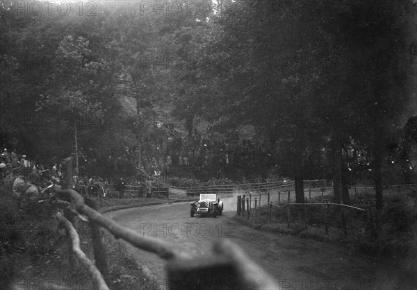 Raymond Mays' 4500 cc Invicta competing in the Shelsley Walsh Speed Hill Climb, Worcestershire. Artist: Bill Brunell.