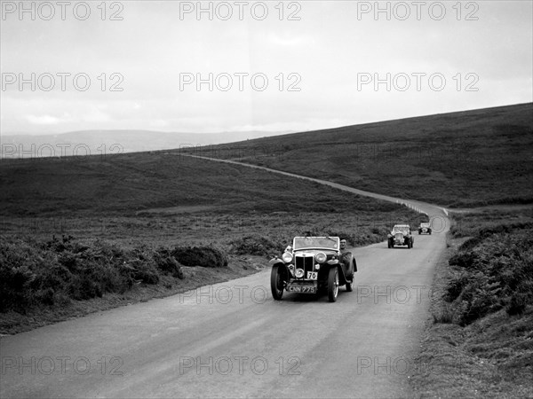 CH Richardson's MG PB ahead of a Singer B37 at the MCC Torquay Rally, July 1937. Artist: Bill Brunell.