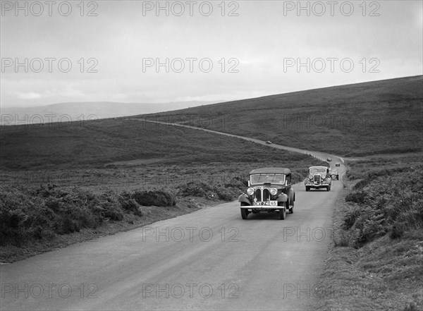 AS Whiddington's Frazer-Nash BMW ahead of RE Wright's Ford V8 at the MCC Torquay Rally, July 1937. Artist: Bill Brunell.