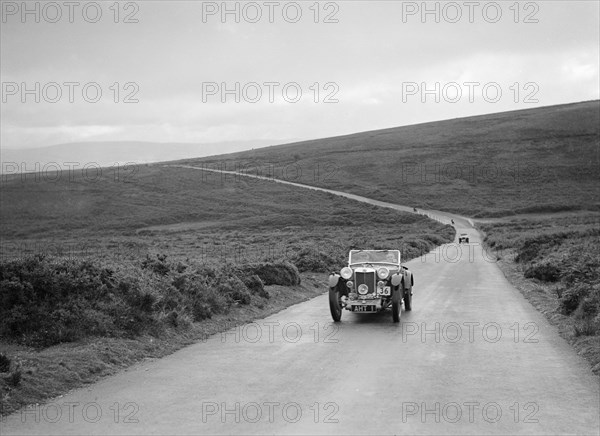 EH Goodenough's MG PB competing at the MCC Torquay Rally, July 1937. Artist: Bill Brunell.