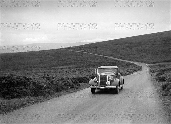 DJH Currie's Ford V8, winner of a silver award at the MCC Torquay Rally, July 1937. Artist: Bill Brunell.