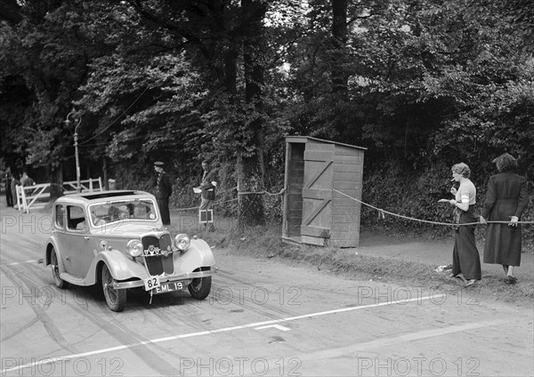 Riley of JM Laing, winner of a bronze award at the MCC Torquay Rally, July 1937. Artist: Bill Brunell.