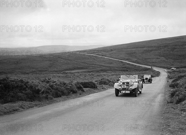 MG Shorey's Riley Lynx leading AL Baker's MG Magnette at the MCC Torquay Rally, July 1937. Artist: Bill Brunell.