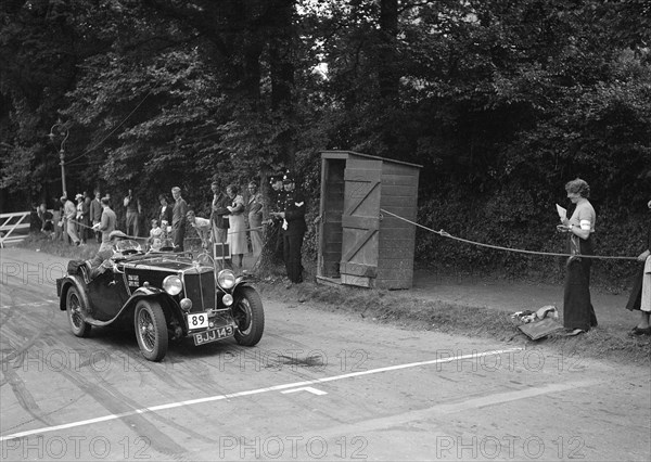 AL Baker's MG Magnette, winner of a bronze award at the MCC Torquay Rally, July 1937. Artist: Bill Brunell.