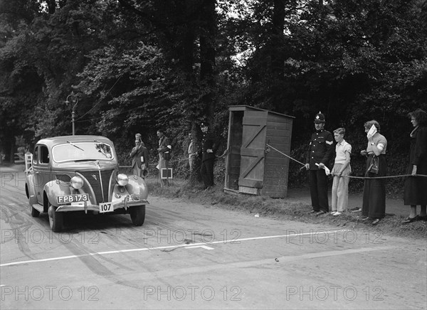 Ford V8 of J Harrison, winner of a bronze award at the MCC Torquay Rally, July 1937. Artist: Bill Brunell.